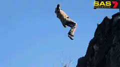 Man cliff jumping into water