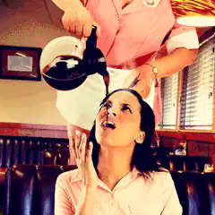 waitress pours coffee into customer's mouth