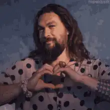 Jason Momoa making a heart shape