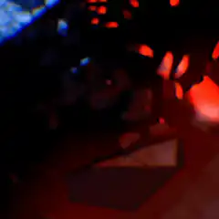 Red eyes and teeth in dark water