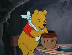 Winnie the Pooh eating honey