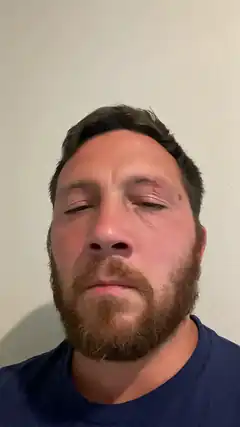 Man with closed eyes and beard