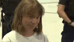 Woman side-eyeing with a smirk