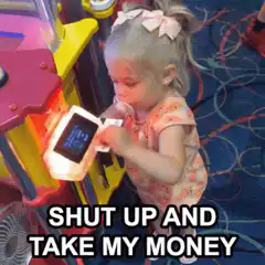 Toddler inserts money into arcade game
