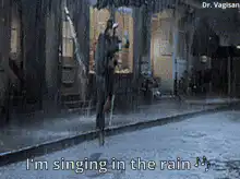 Man dancing in the rain with umbrella