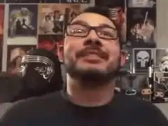 Man screaming with hands on face