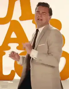 Leonardo DiCaprio clapping and smiling