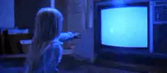 Carrie telekinetically turns on the TV