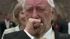 Old man crying at wedding
