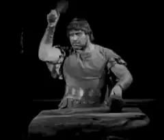 Man hammering and rowing