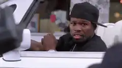 50 Cent in a car looking surprised