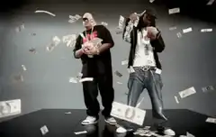 Two men dancing in falling money