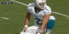 Football player catches ball laces out