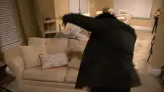 Man flips couch in living room