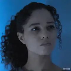 Woman looking up with blue lighting