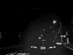Car driving at night with rain
