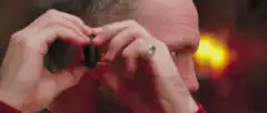 man putting on nose hair trimmer