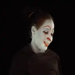 scary clown gives thumbs up