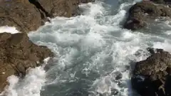Ocean waves crashing on rocks