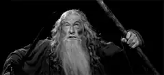 Gandalf raises sword and staff