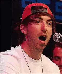 Man with red cap shocked face