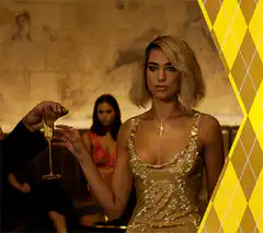Woman in gold dress sips champagne
