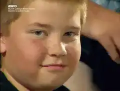 Boy smirking at camera