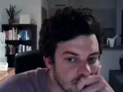 man biting nails nervously