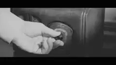 hand turning radio dial