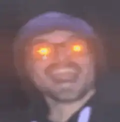 Man with glowing orange eyes