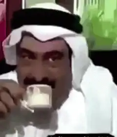 Man drinking coffee and smiling