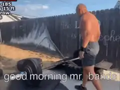 shirtless man lifts barbell with resistance bands