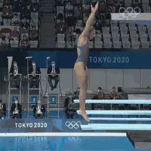 Olympic diver performs backflip into pool