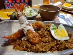 Japanese curry rice with fried shrimp and egg