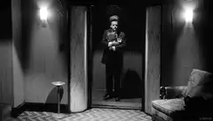 Norman Bates standing in doorway
