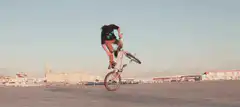 BMX rider doing a wheelie