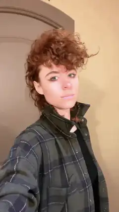 Woman with curly hair zooms in