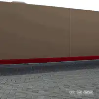 Red muscle car drives by