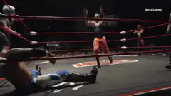 Wrestler hits a diving splash