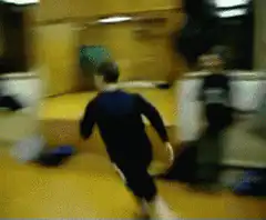 person running and jumping into a wall