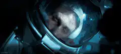 Astronaut looking up in space helmet