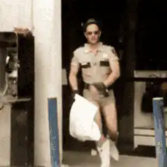 Man in police uniform dancing