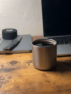 coffee cup on wooden desk