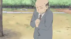 Bald man opens jacket to reveal vest