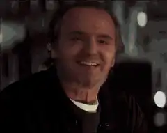 John Cusack smiling and nodding