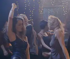 Two women dancing at a party
