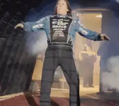 Man in racing suit dancing