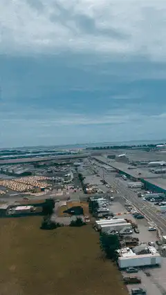 Aerial view of airport tarmac and highway
