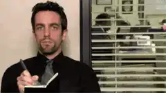 Jim Halpert writing in notepad