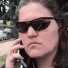 Woman in sunglasses on phone